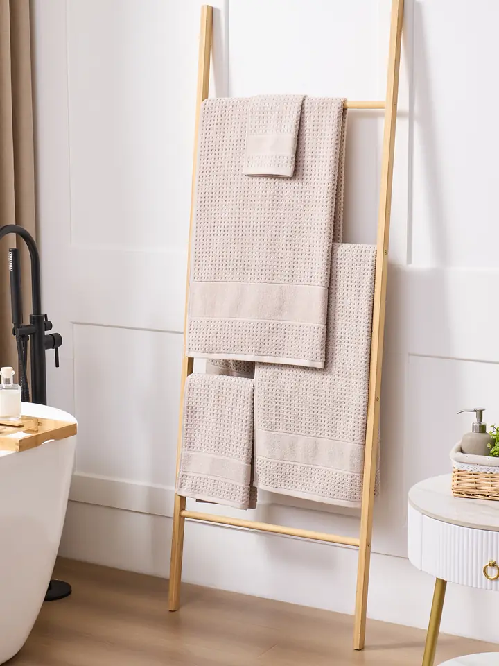 Beige waffle towels on a ladder
