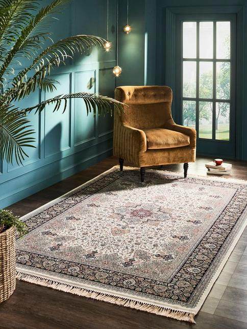 Traditional area rug in a teal room