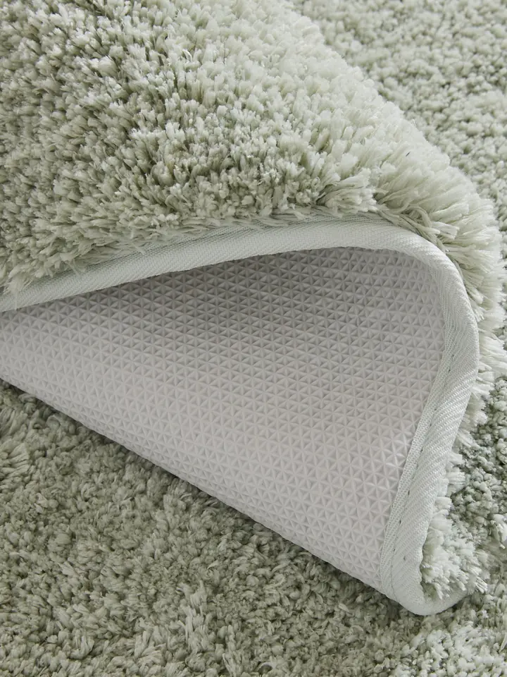 Sage shag bath rug showing non-slip backing